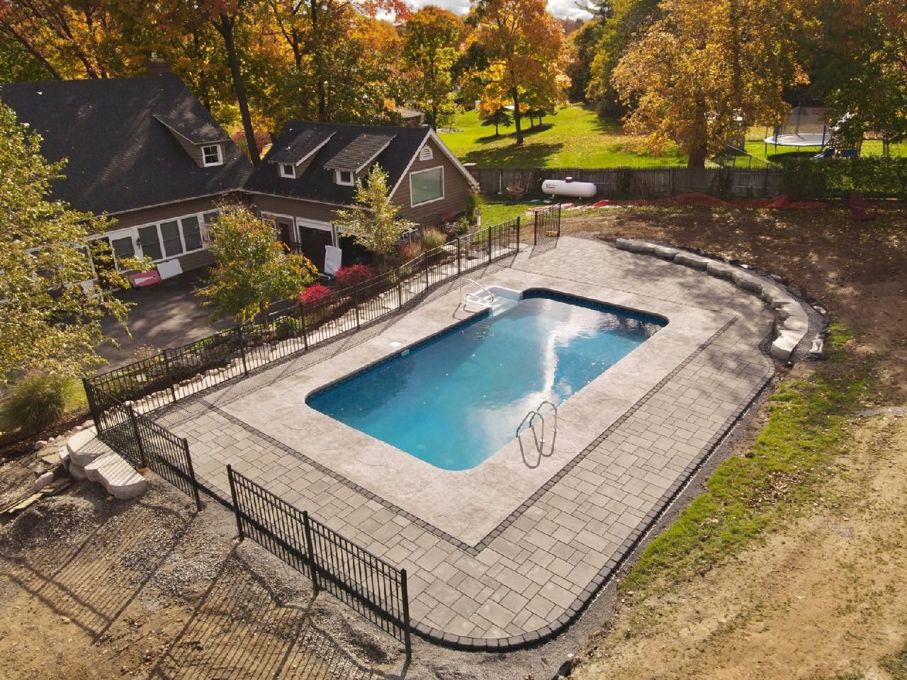 Stamped concrete pool deck installation in Syracuse NY by Xtreme Companies
