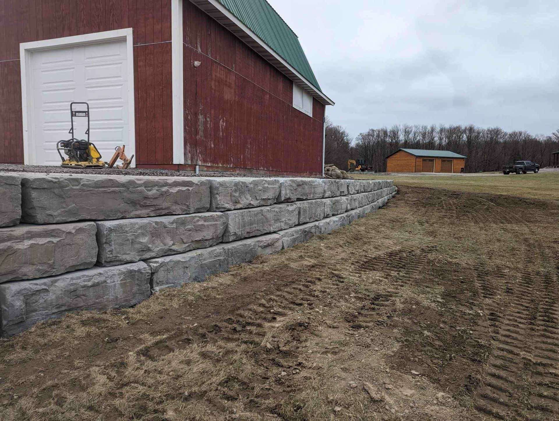 Decorative retaining wall installation in Syracuse NY by Xtreme Companies