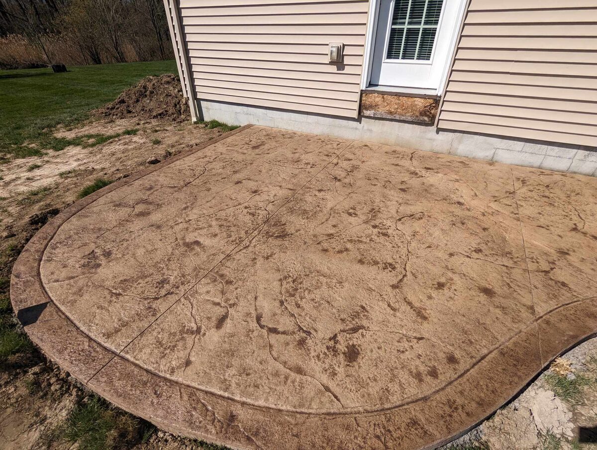 Stamped concrete patio with rounded border in Syracuse NY