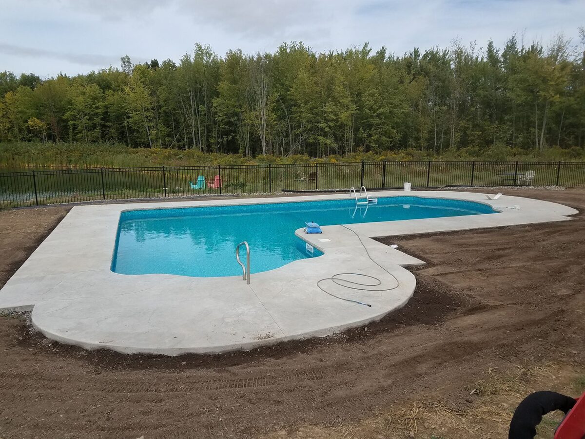 Stamped concrete pool deck installation by Xtreme Companies in Syracuse NY