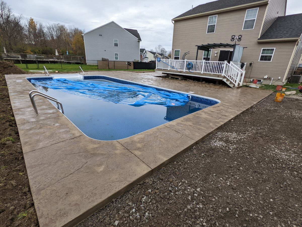 New stamped concrete pool surround installation in Central New York