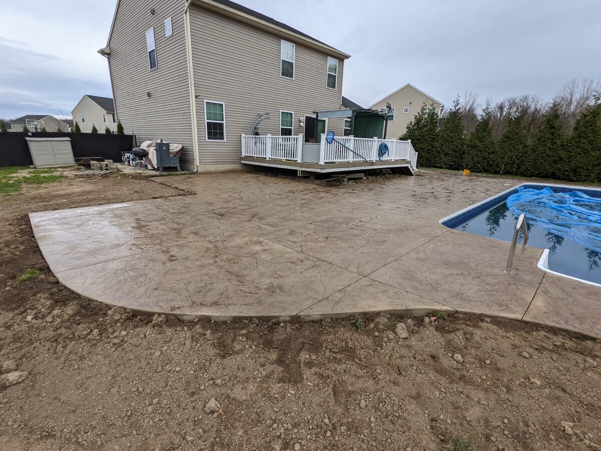 Stamped concrete pool patio and backyard hardscape in Central New York