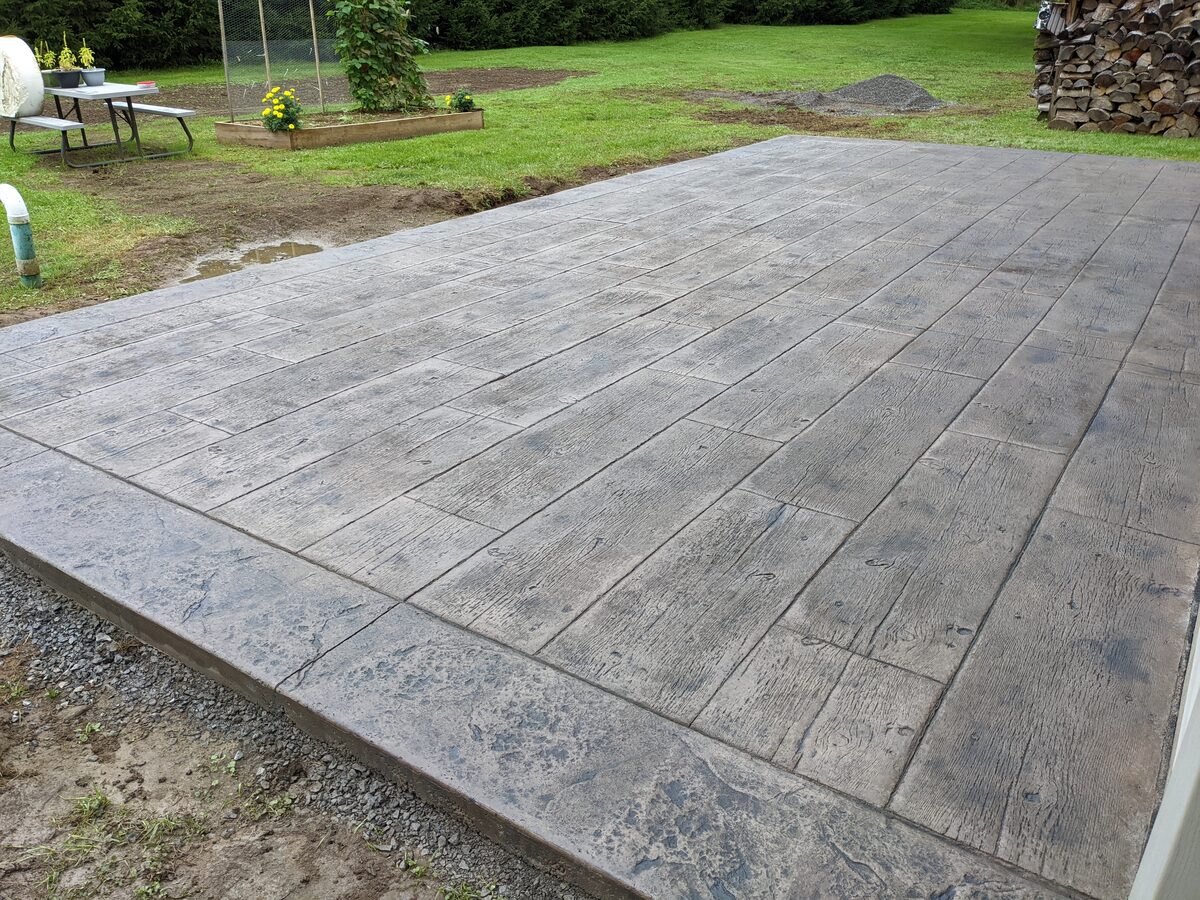 Wood plank pattern stamped concrete patio completed in Central New York